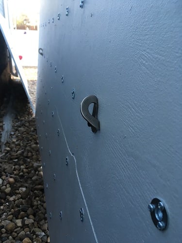 Bolt hangers to attach rope to lift panel into place